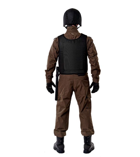 Black bulletproof vest Fagor dressed on a man in a helmet, rear view in full growth