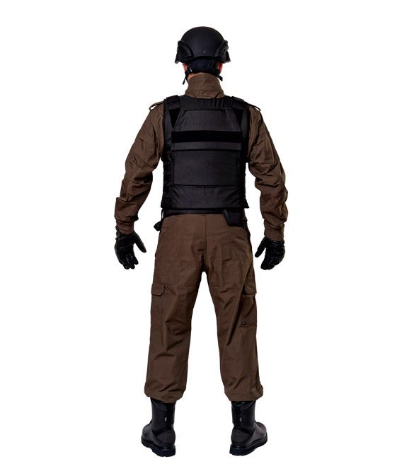 Black bulletproof vest Segment dressed on a man in a helmet, rear view in full growth
